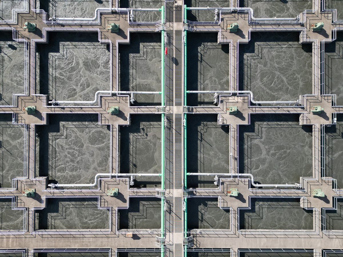 Aerial view of aeration tanks and pipework at a water treatment facility